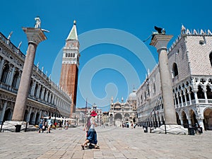 Venice, San Marco, Italy - July 2020. Tourist are slowly back in deserted Venice  Saint Marcus square after covid-19 outbreak city